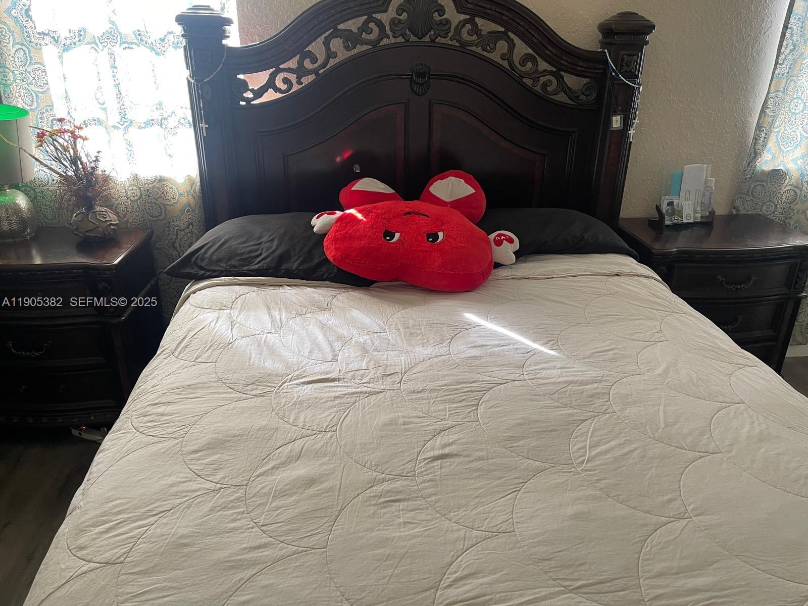 665 Northwest 153rd Street Miami, FL 33169 - Photo 19 of 28 a bedroom with a bed and a window