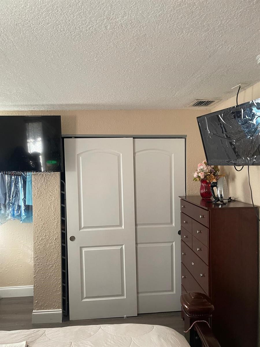 665 Northwest 153rd Street Miami, FL 33169 - Photo 21 of 28 a view of a livingroom with furniture and cabinet