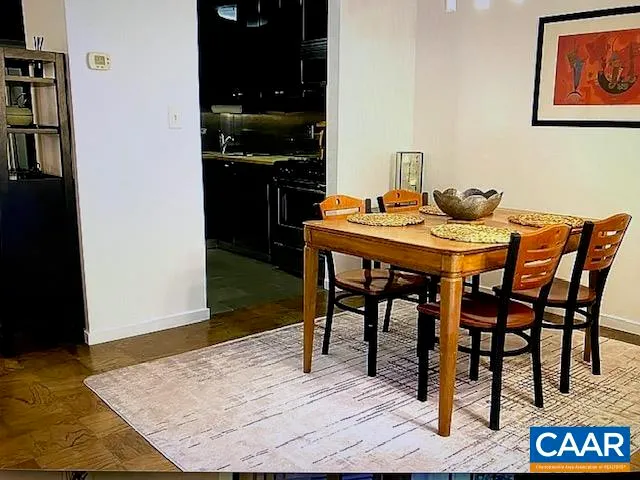 a dining room with a table and chairs