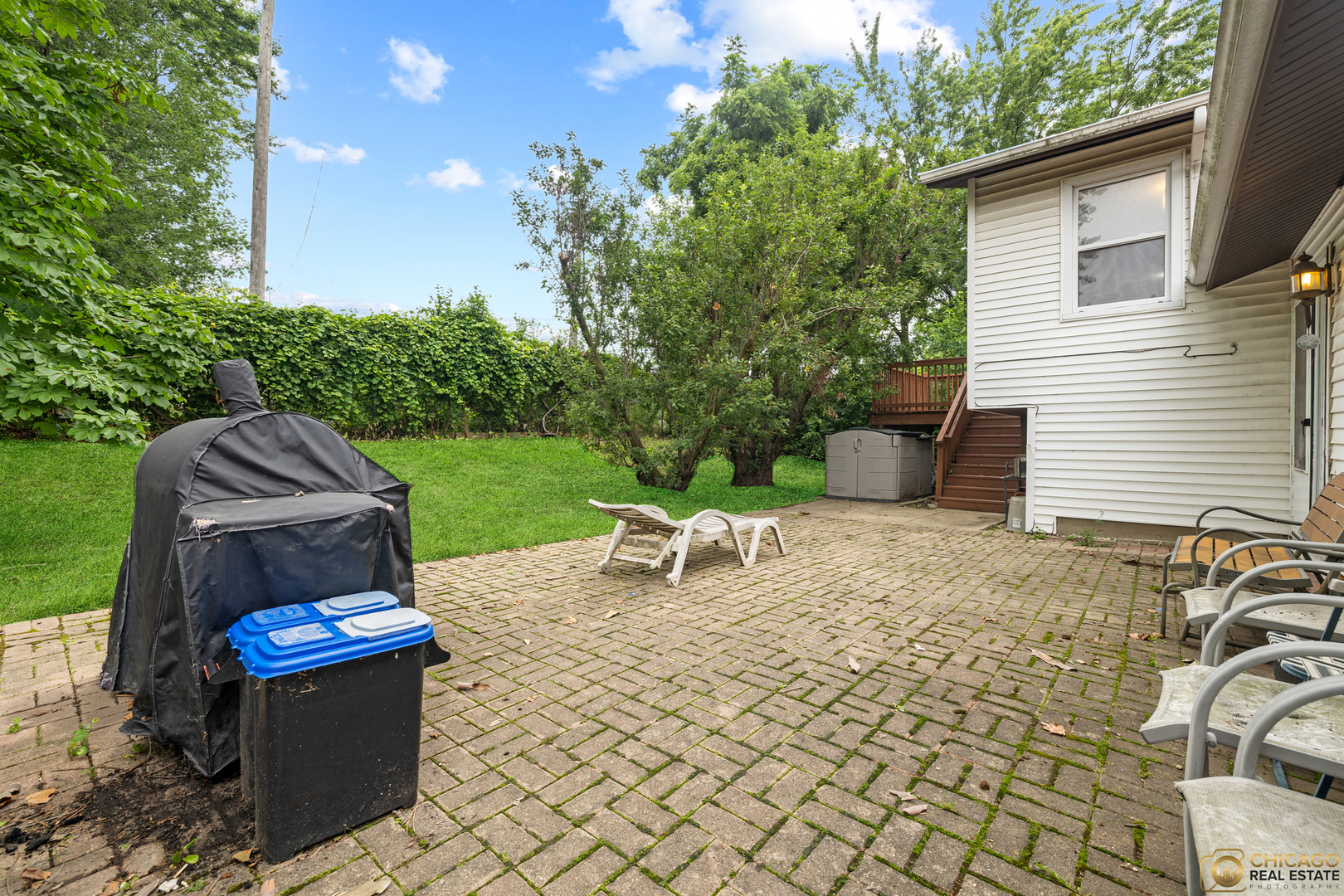 220 Osage Terrace Buffalo Grove, IL 60089 - Photo 8 of 24 a backyard of a house with outdoor seating