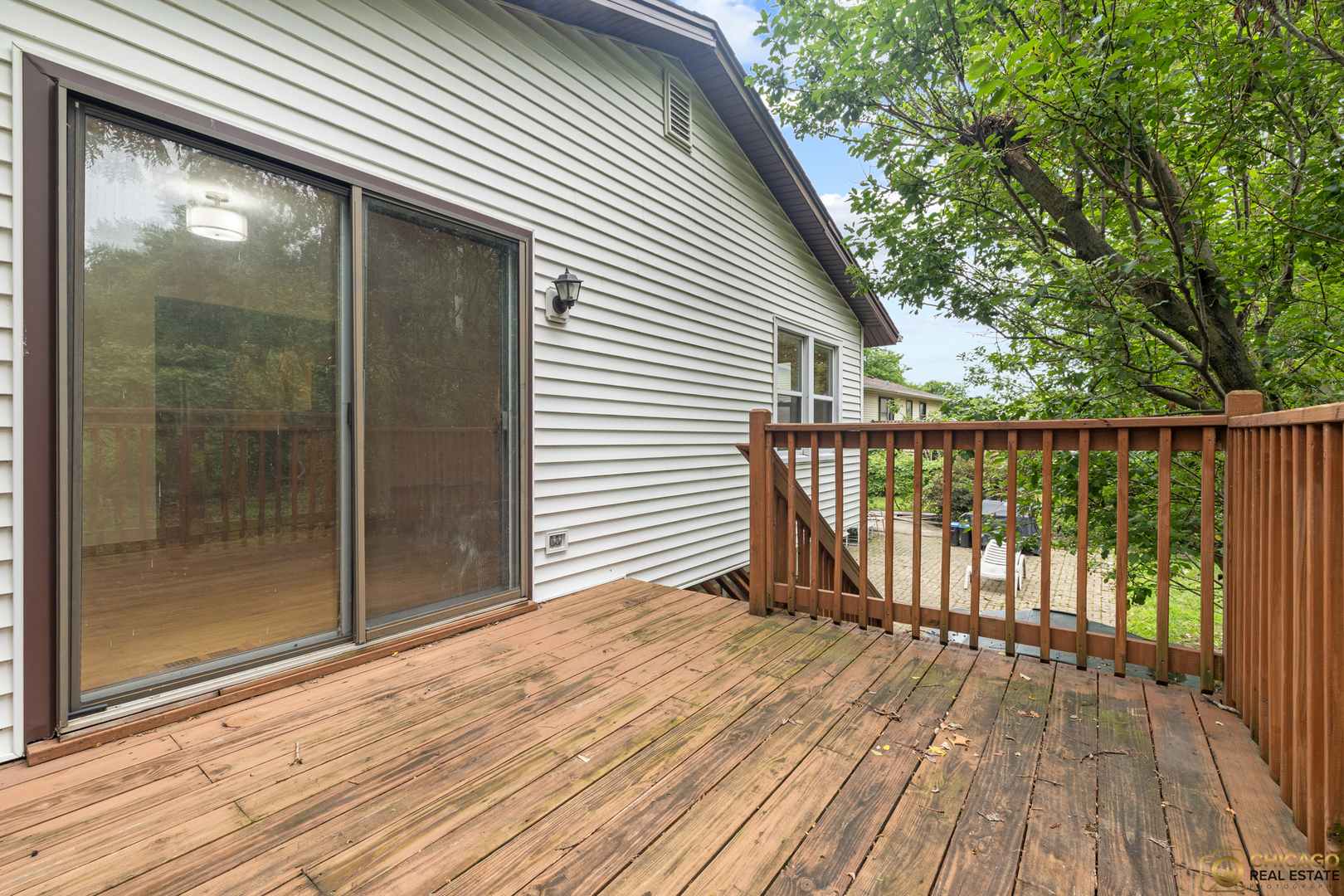 220 Osage Terrace Buffalo Grove, IL 60089 - Photo 12 of 24 a view of backyard with a deck