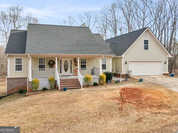 a front view of a house with outdoor seating