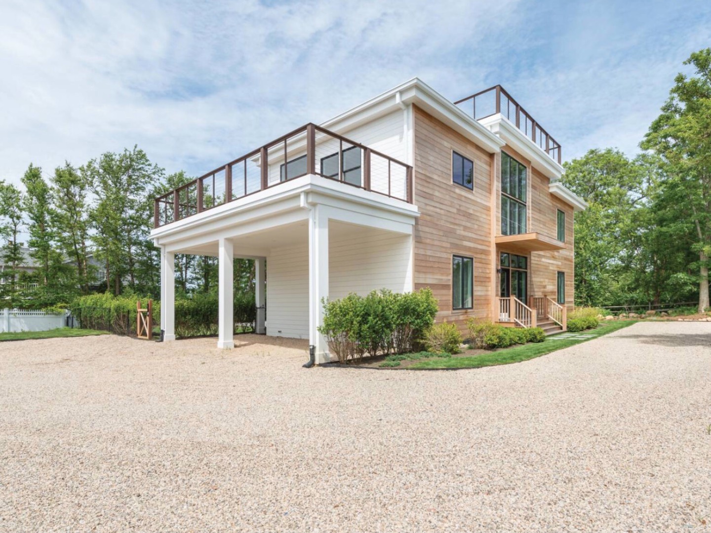 front view of a house with a garden
