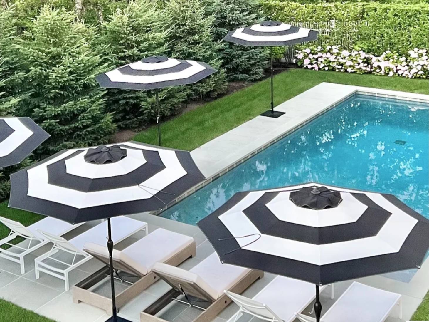 2 Captain Kidds Path Montauk, NY 11954 - Photo 11 of 15 a view of a table and chairs in patio with a yard