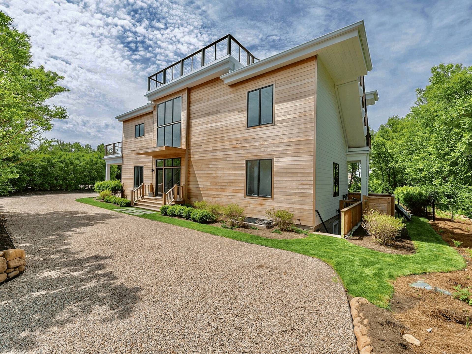 2 Captain Kidds Path Montauk, NY 11954 - Photo 14 of 15 a front view of a house with garden