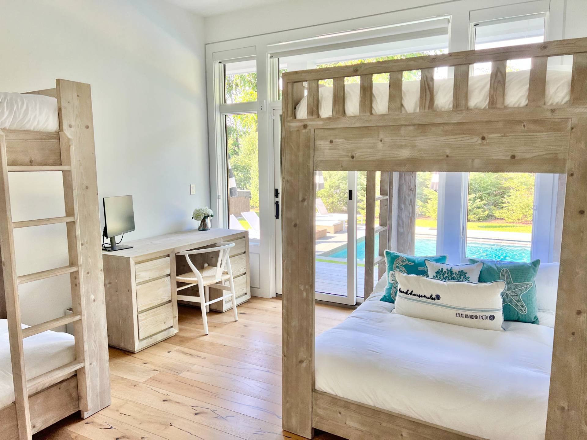 2 Captain Kidds Path Montauk, NY 11954 - Photo 5 of 15 a living room with furniture and a large window