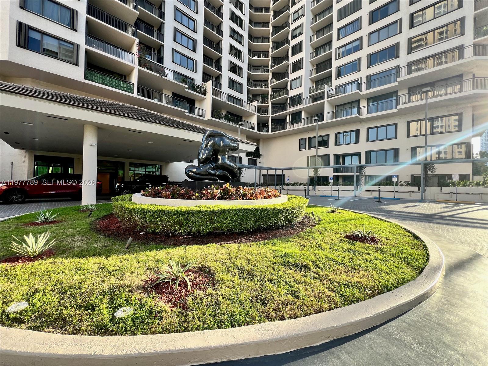 540 Brickell Key Drive, Unit 202 Miami, FL 33131 - Photo 1 of 25 a swimming pool with outdoor seating and yard