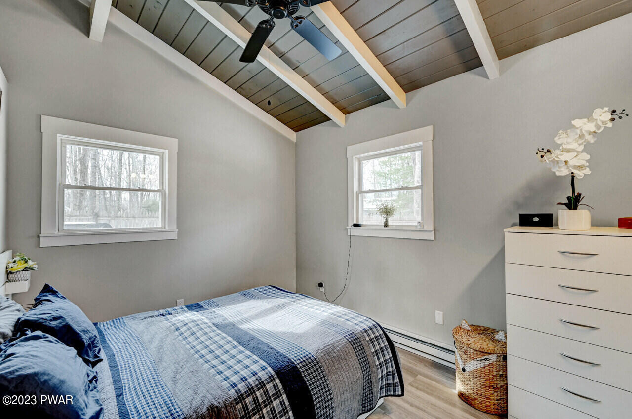 119 Hemlock Road Milford, PA 18337 - Photo 27 of 42 a bedroom with a bed and a window