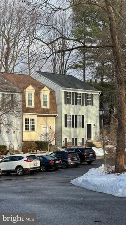 a view of a city street lined with buildings and cars