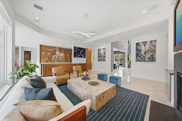 a living room with furniture and a table