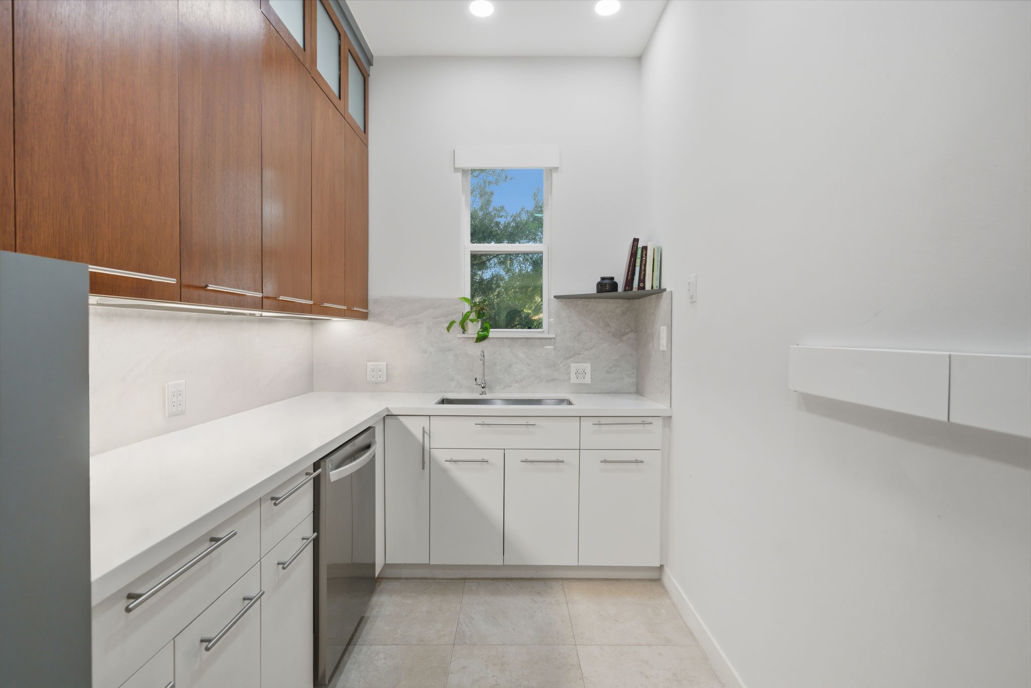 3 Farington Way The Woodlands, TX 77382 - Photo 14 of 49 a kitchen with sink cabinets and a window