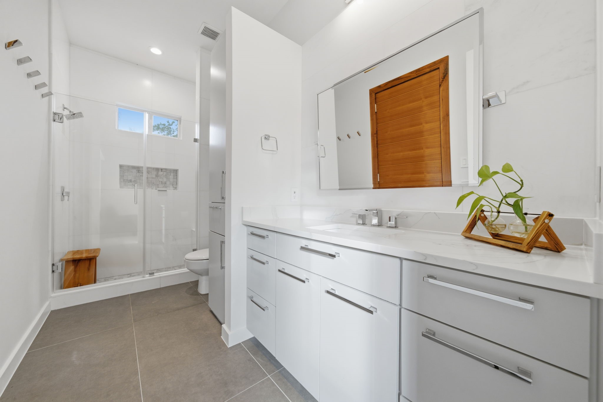 3 Farington Way The Woodlands, TX 77382 - Photo 27 of 49 a bathroom with a sink a toilet and shower