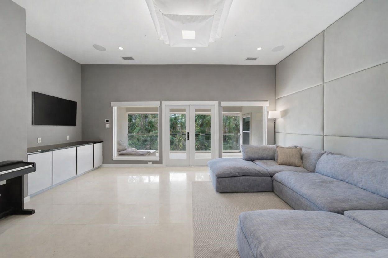 3 Farington Way The Woodlands, TX 77382 - Photo 29 of 49 a living room with furniture and a flat screen tv