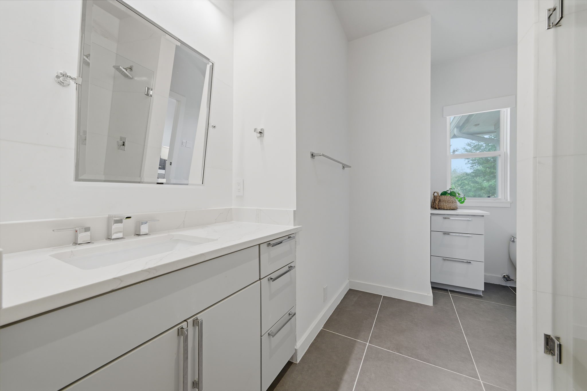 3 Farington Way The Woodlands, TX 77382 - Photo 32 of 49 a bathroom with a sink and a mirror