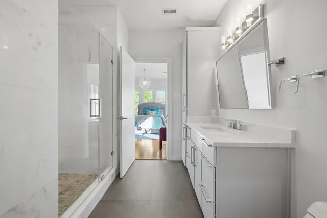a bathroom with a double vanity sink and a mirror