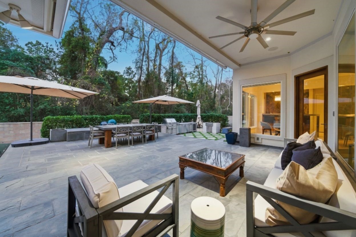 3 Farington Way The Woodlands, TX 77382 - Photo 40 of 49 a view of a patio with table and chairs barbeque potted plants and large tree