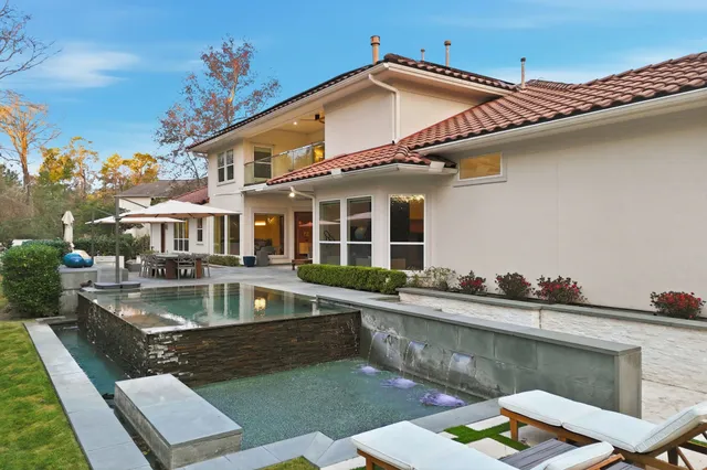 a front view of a house with swimming pool