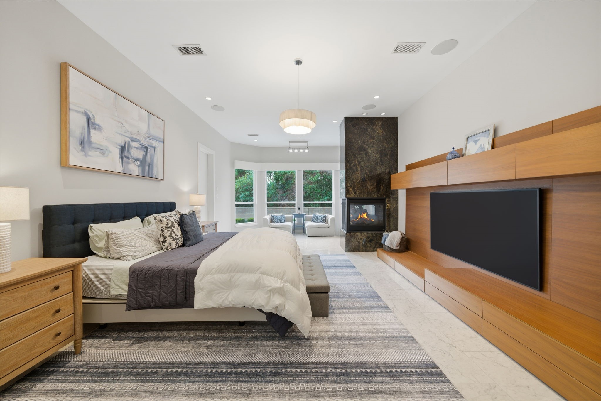 3 Farington Way The Woodlands, TX 77382 - Photo 5 of 49 a spacious bedroom with a large bed and a flat screen tv