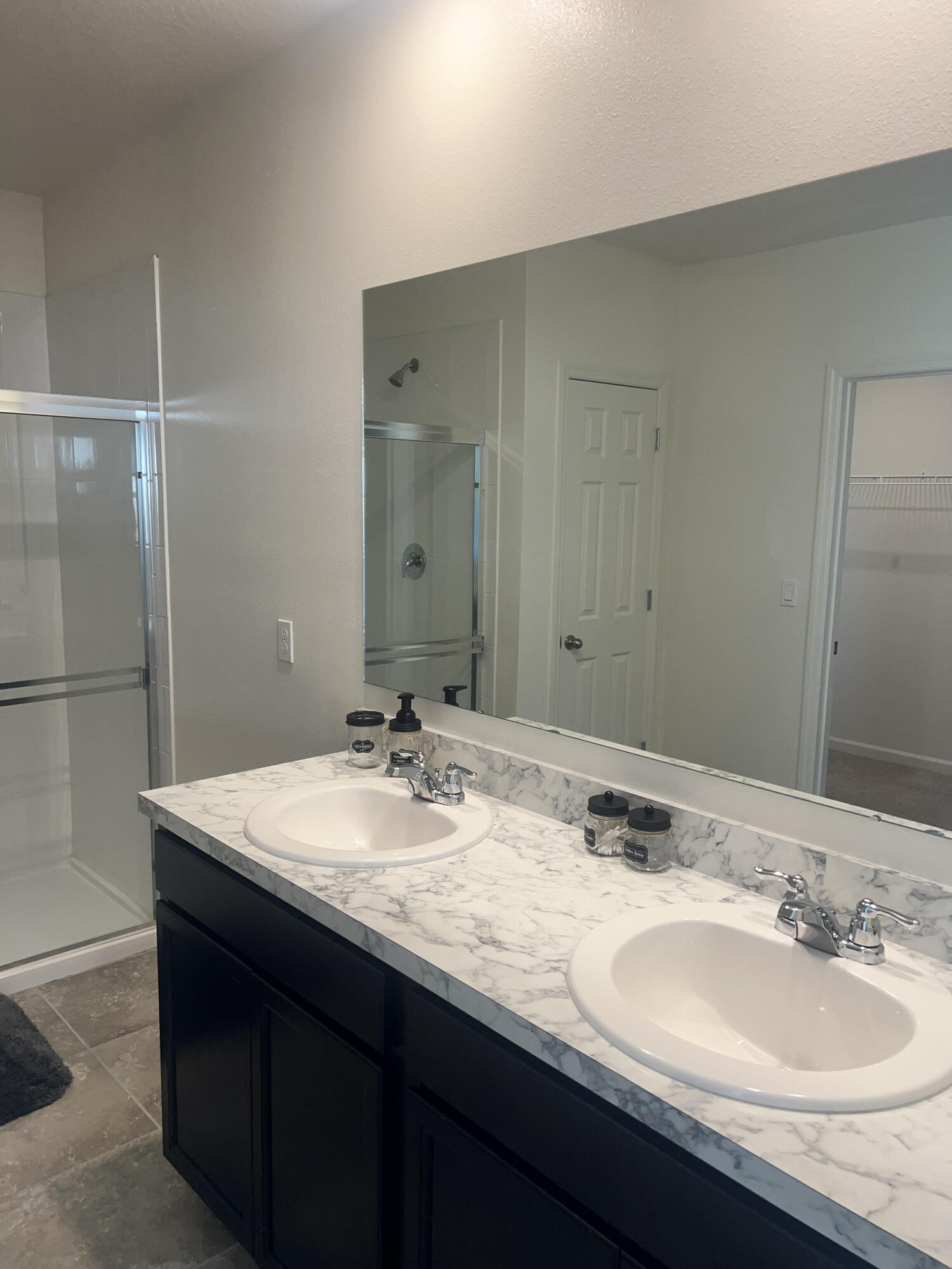 3213 Trinity Circle Fort Pierce, FL 34945 - Photo 12 of 20 a bathroom with a granite countertop sink and a mirror