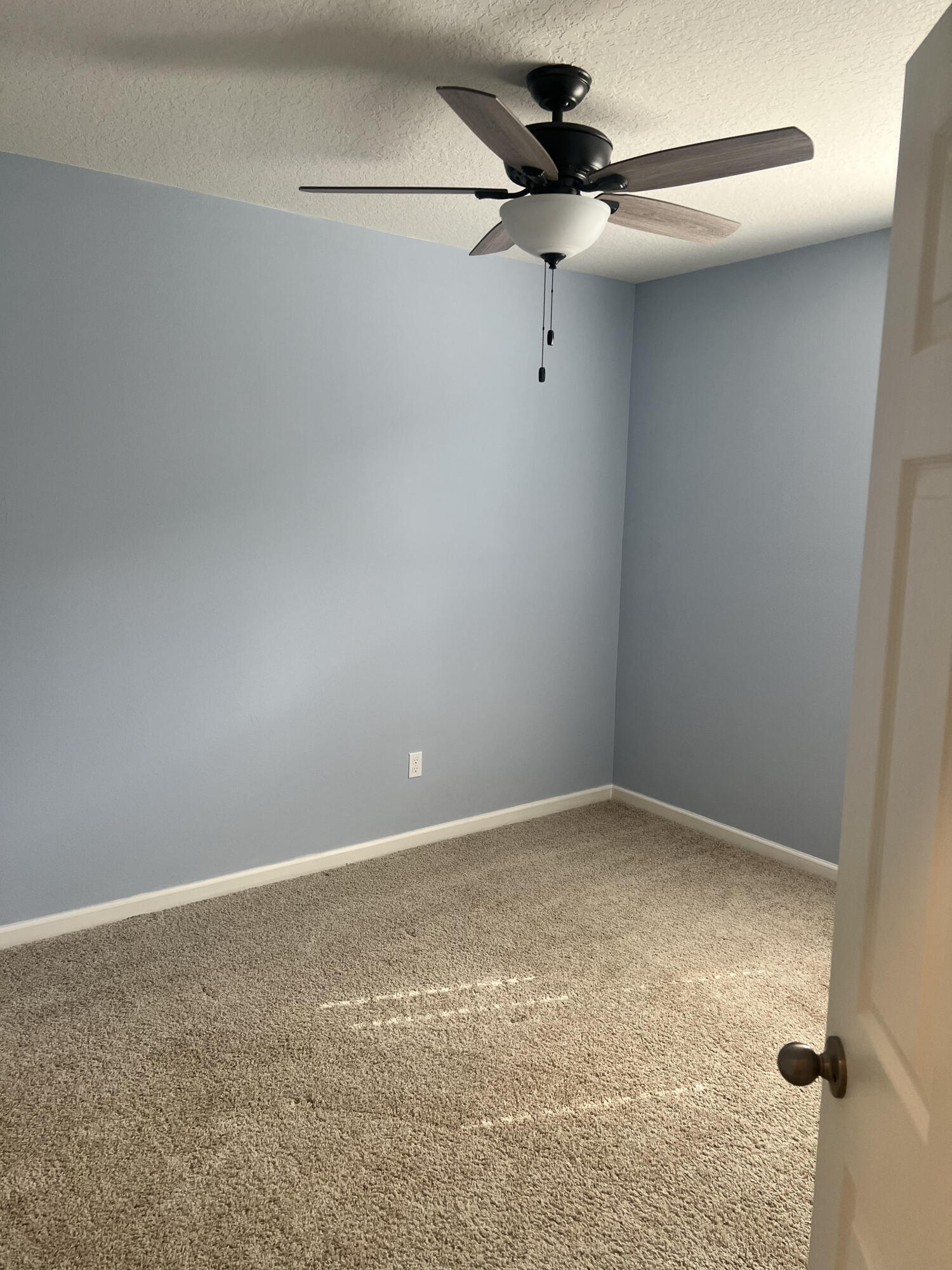 3213 Trinity Circle Fort Pierce, FL 34945 - Photo 16 of 20 a view of a small space with a fan