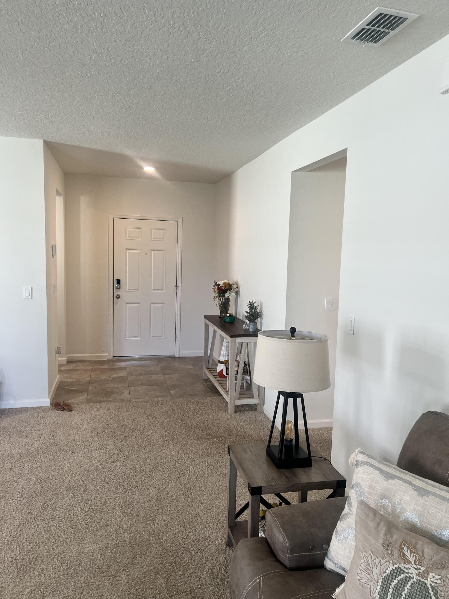 3213 Trinity Circle Fort Pierce, FL 34945 - Photo 2 of 20 a room with furniture and a window