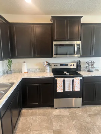 a kitchen with a sink and a microwave