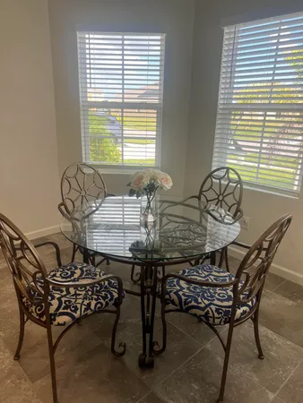 a view of a dining room with furniture and windows