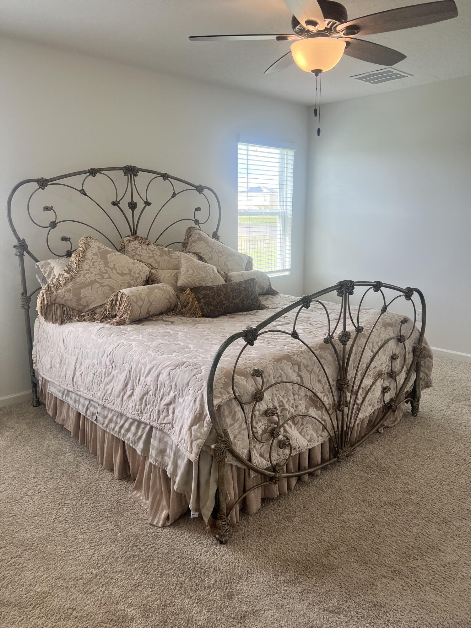 3213 Trinity Circle Fort Pierce, FL 34945 - Photo 10 of 20 a bedroom with a bed and a chandelier