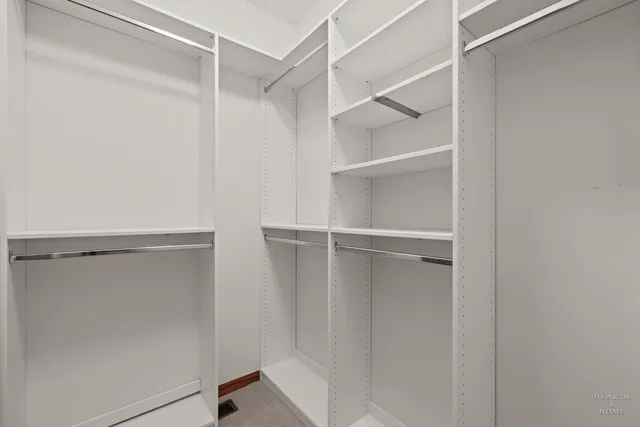 a view of an empty walk in closet