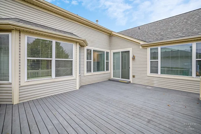 a view of a house with wooden deck