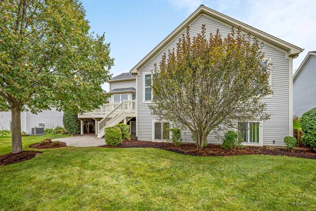 a view of a house with a backyard