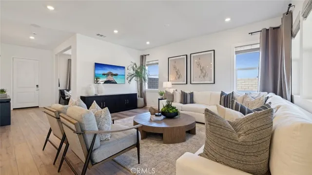 a living room with furniture and a large window