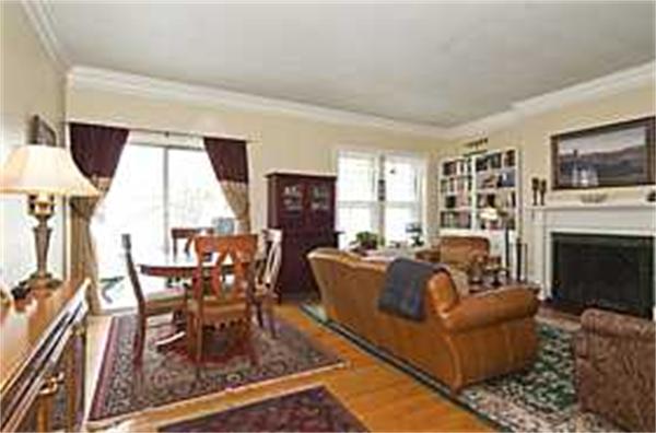 208 Fuller Street, Unit 9 Brookline, MA 02446 - Photo 1 of 1 a living room with furniture a fireplace and a flat screen tv