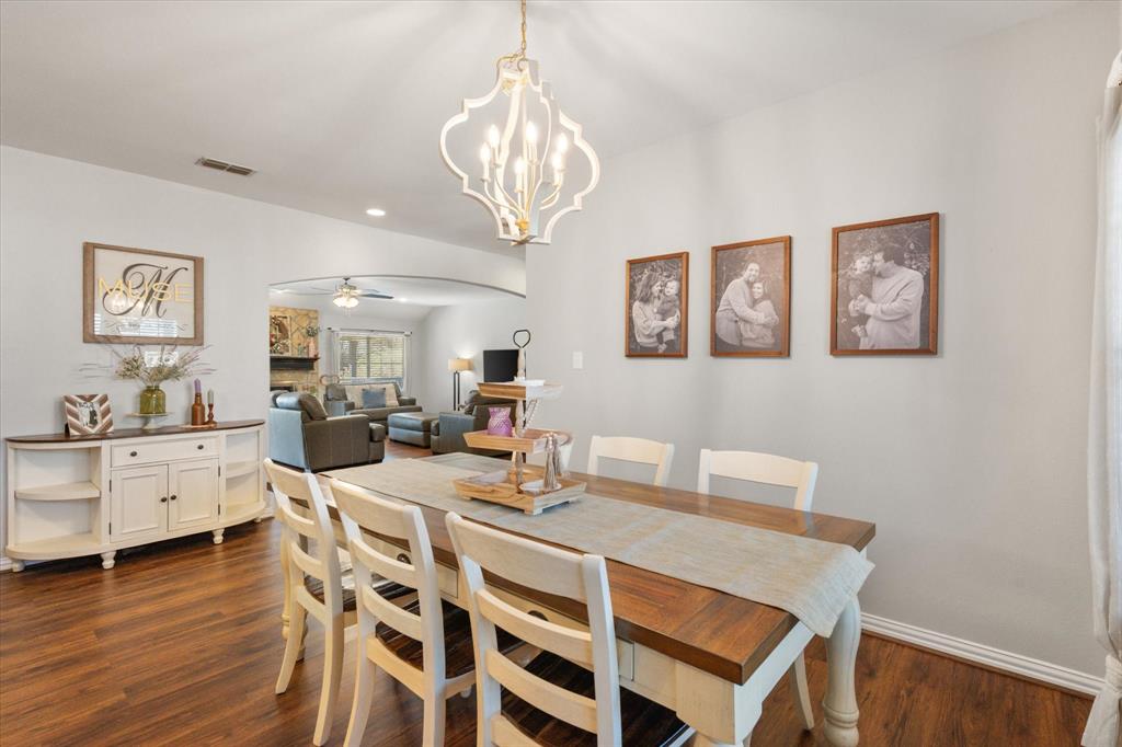100 Ruth Court Aledo, TX 76008 - Photo 19 of 40 a view of a dining room with furniture and wooden floor