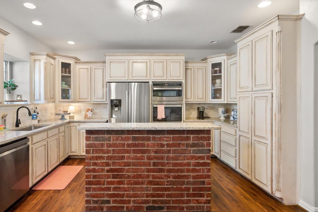 100 Ruth Court Aledo, TX 76008 - Photo 25 of 40 a large kitchen with cabinets