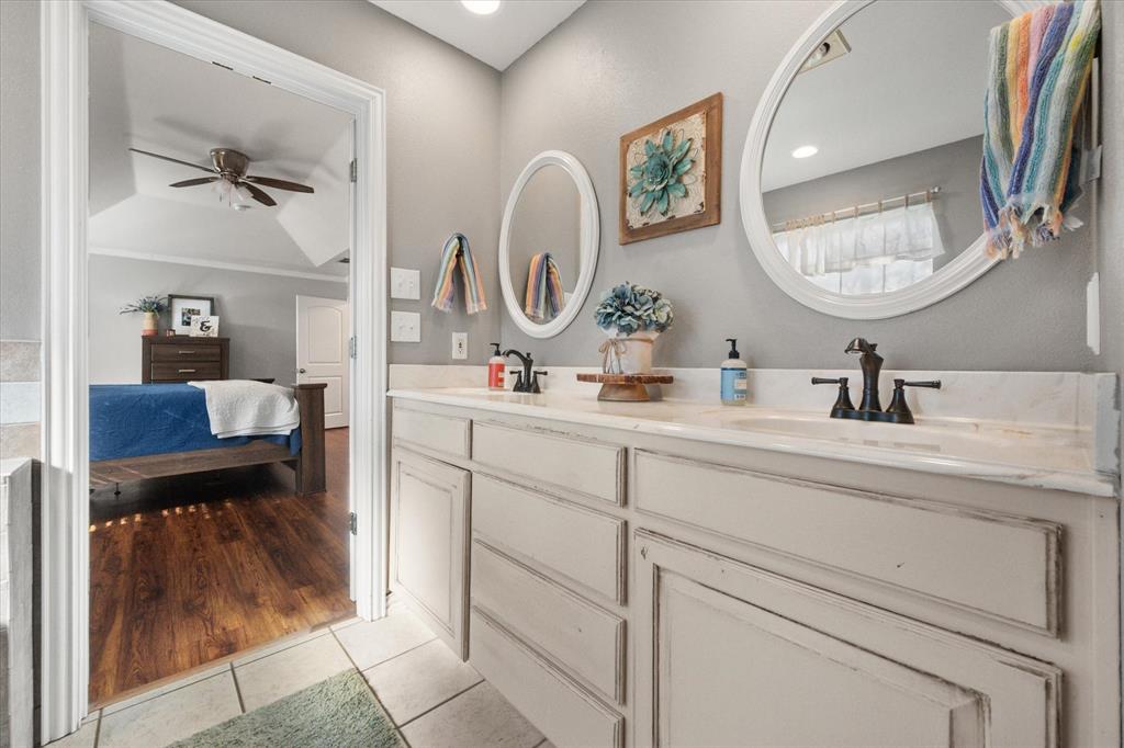 100 Ruth Court Aledo, TX 76008 - Photo 29 of 40 a bathroom with a sink and a mirror