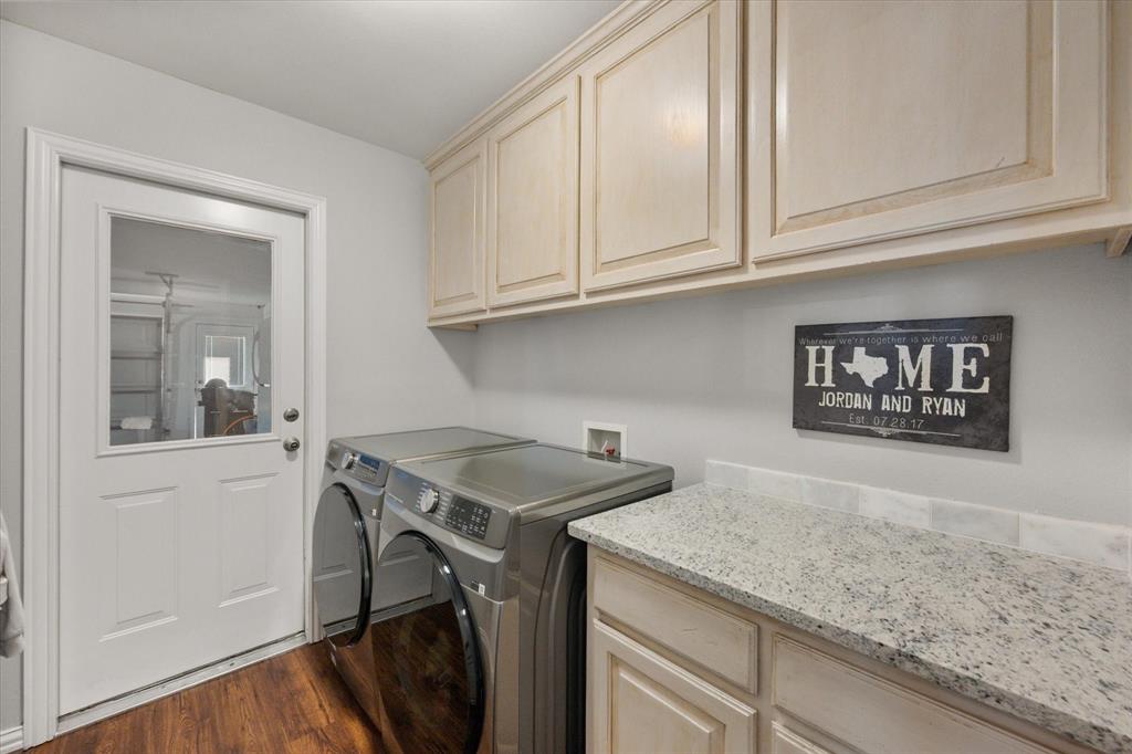 100 Ruth Court Aledo, TX 76008 - Photo 34 of 40 a kitchen with stainless steel appliances granite countertop a sink a stove and cabinets