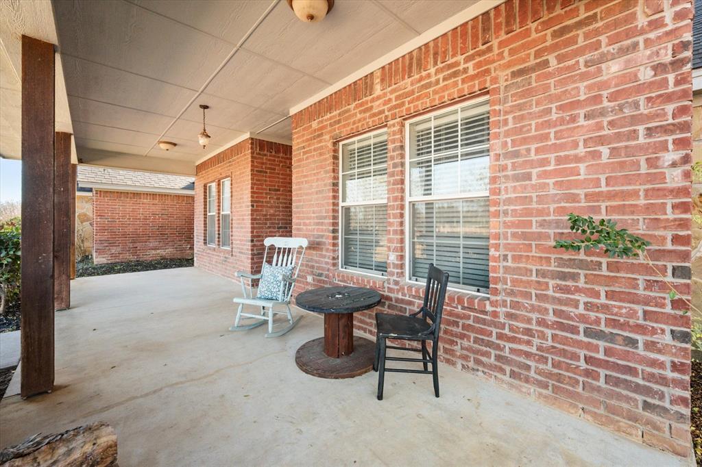 100 Ruth Court Aledo, TX 76008 - Photo 4 of 40 a view of a patio with a table and chairs