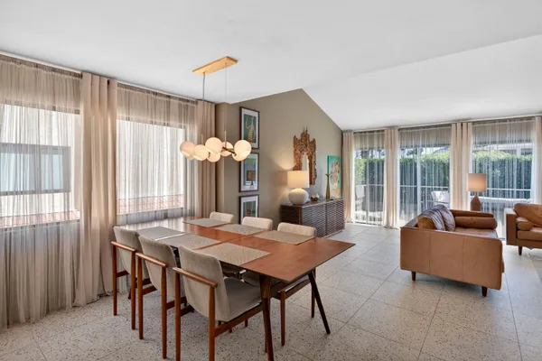 a view of a dining room with furniture window and outside view