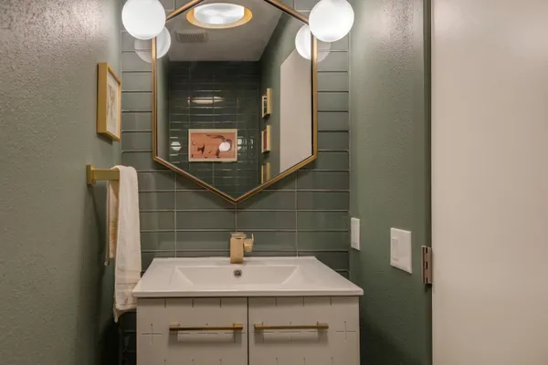 a bathroom with a sink and a mirror