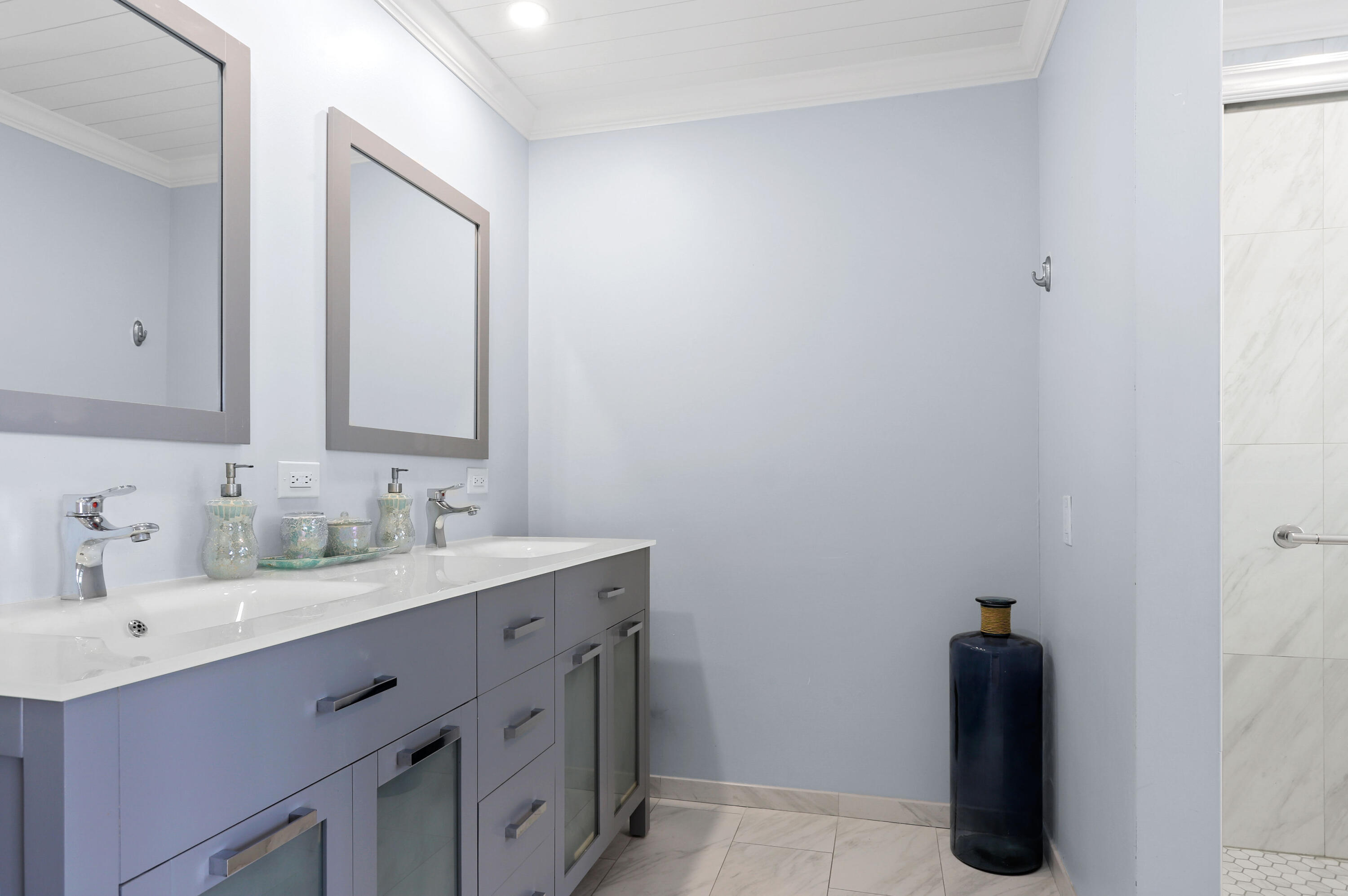 111 Ocean Dunes Circle Jupiter, FL 33477 - Photo 9 of 26 a bathroom with a sink and mirror