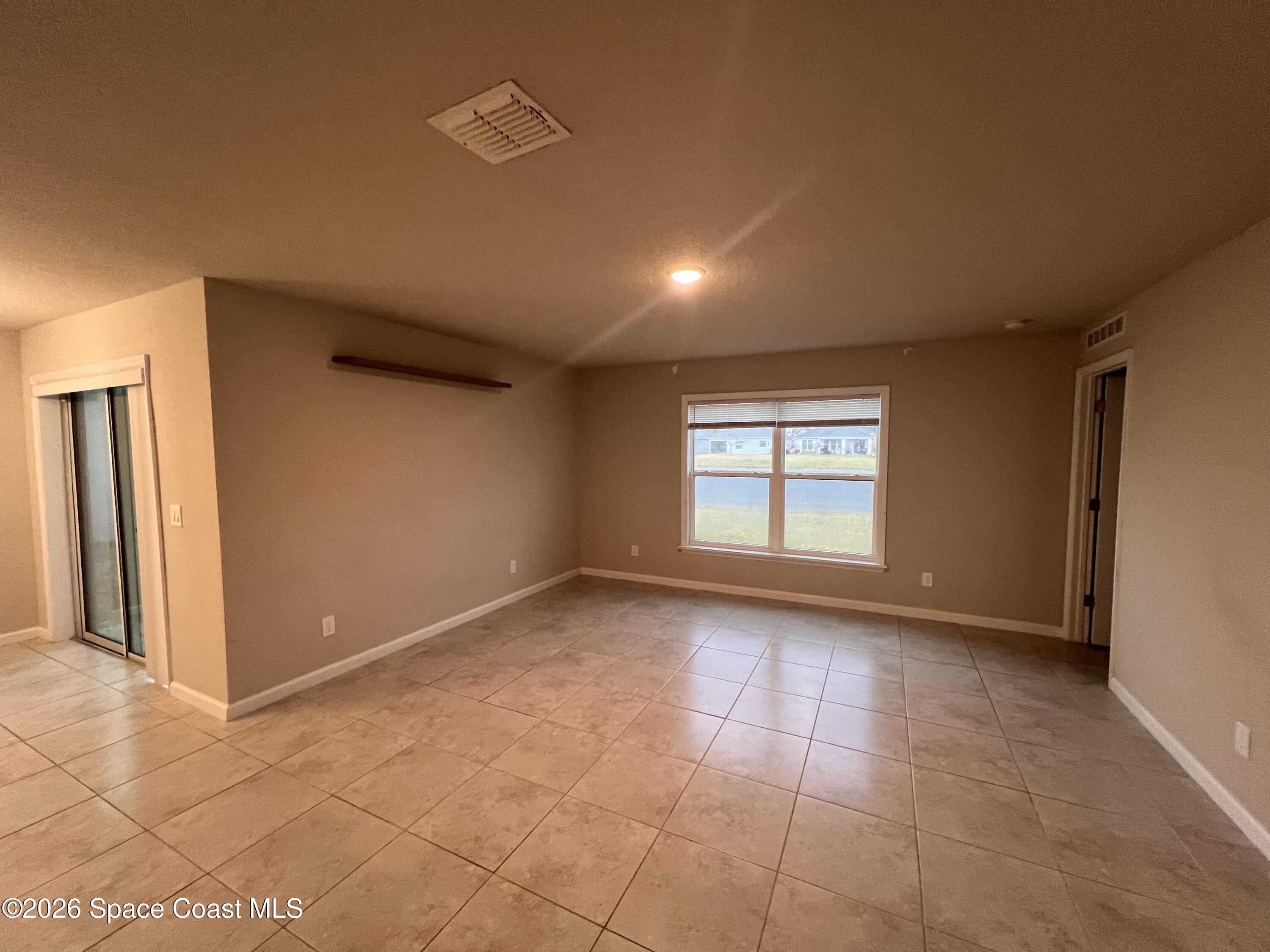 545 Cooper Court Palm Bay, FL 32908 - Photo 15 of 19 a view of an empty room with a window