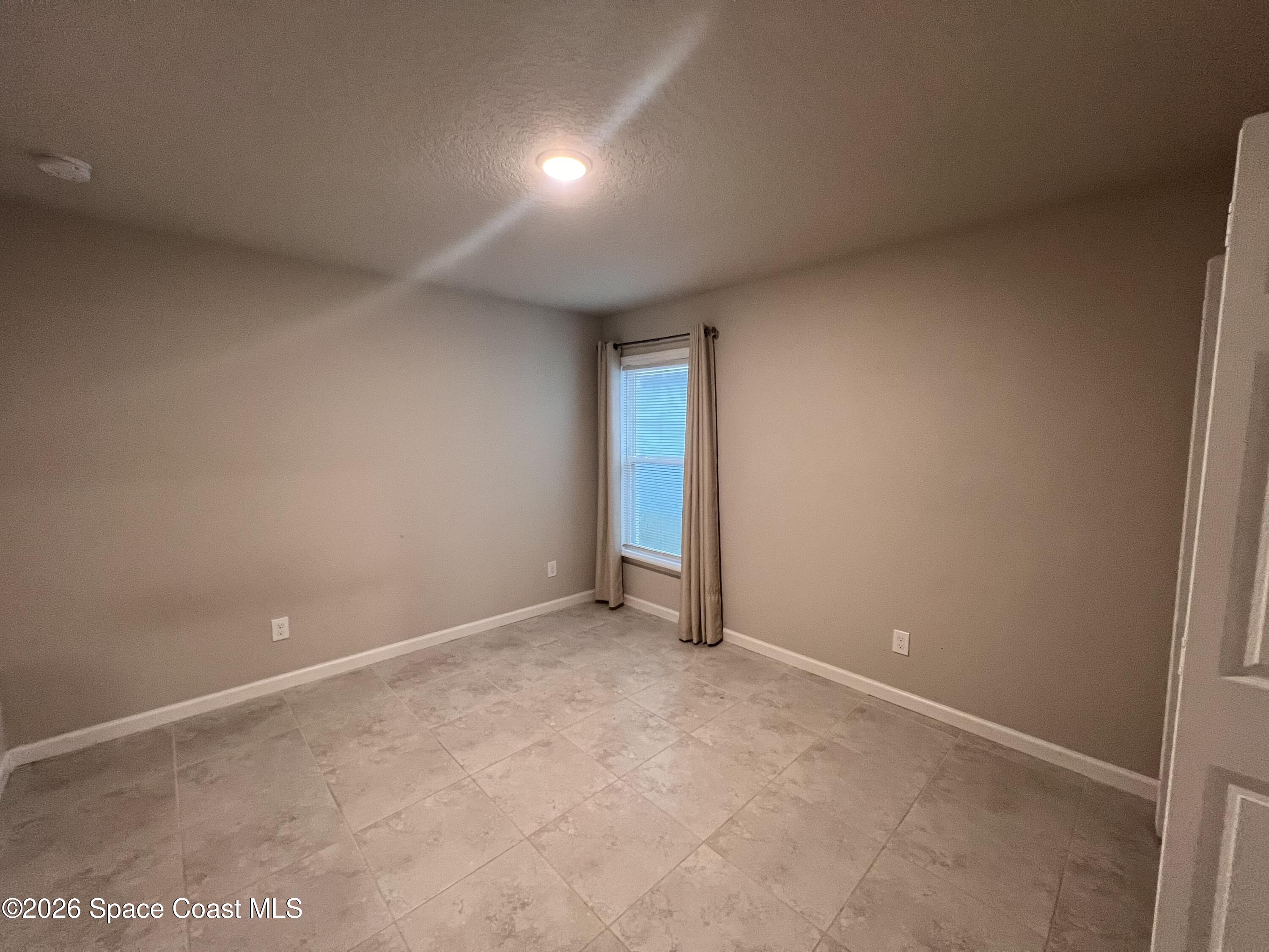 545 Cooper Court Palm Bay, FL 32908 - Photo 6 of 19 a view of an empty room