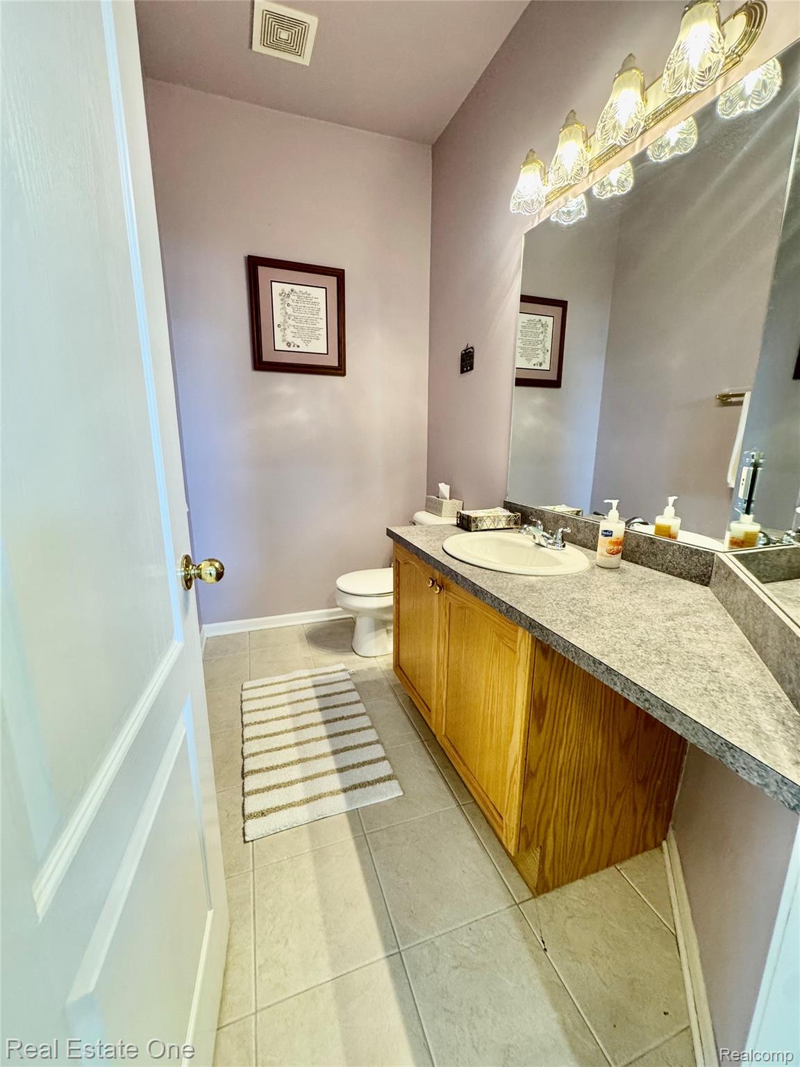 1668 South Shore Drive Rochester, MI 48307 - Photo 23 of 27 Bathroom featuring vanity and light tile patterned floors