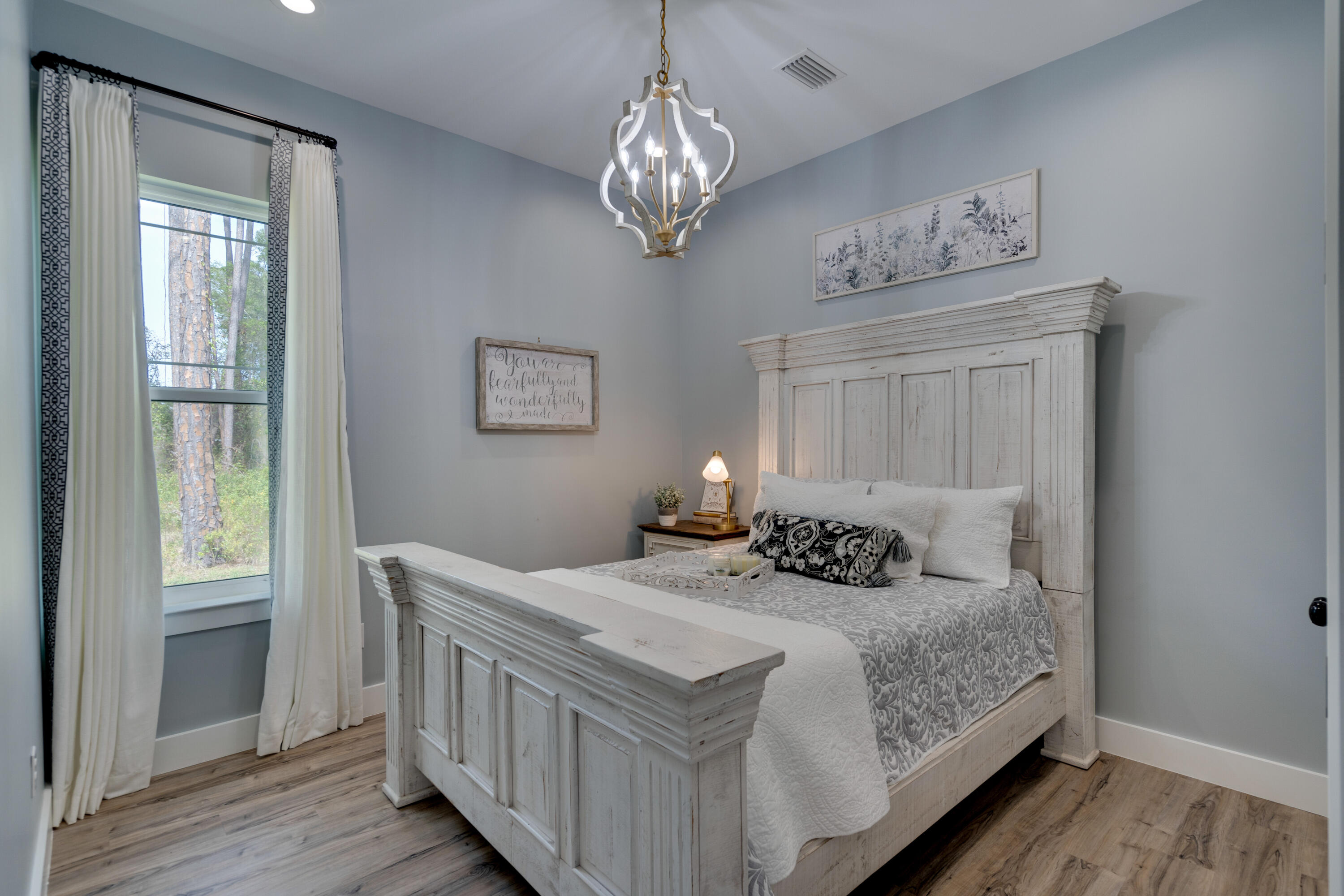 334 Driftwood Point Road Santa Rosa Beach, FL 32459 - Photo 20 of 50 a bedroom with a bed and wooden floor