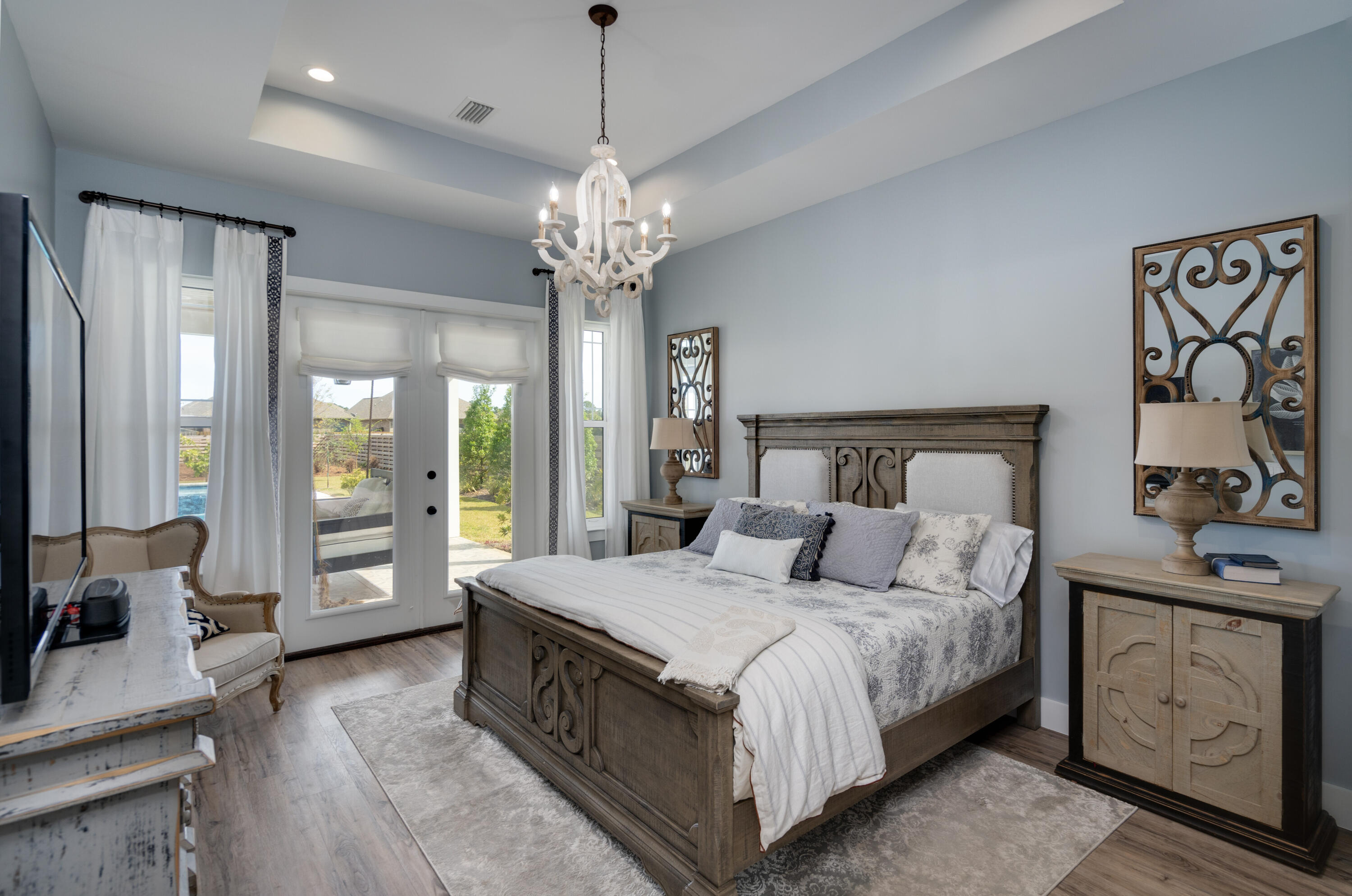 334 Driftwood Point Road Santa Rosa Beach, FL 32459 - Photo 21 of 50 a bedroom with a large bed and a chandelier