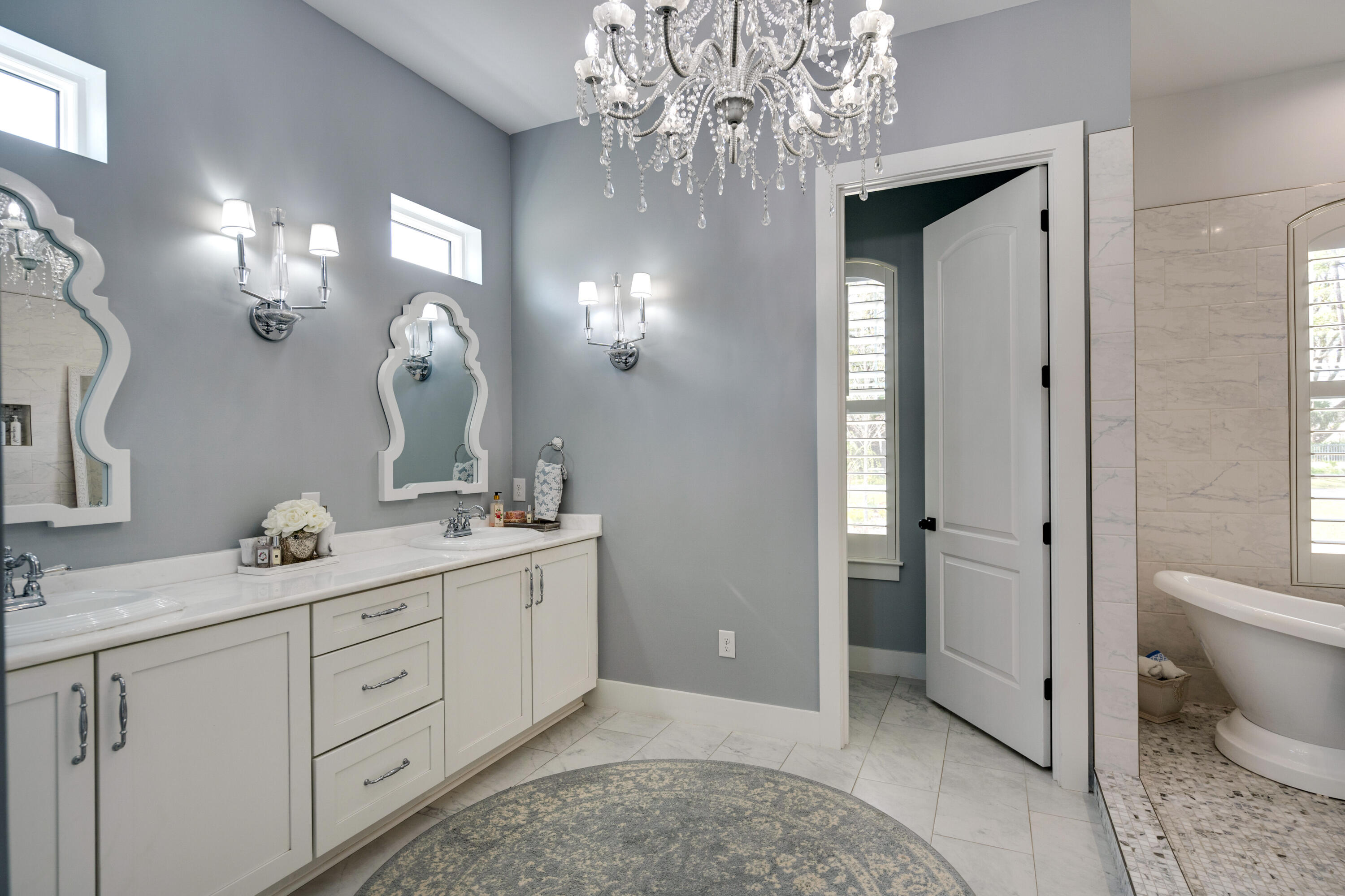 334 Driftwood Point Road Santa Rosa Beach, FL 32459 - Photo 25 of 50 a spacious bathroom with a granite countertop sink a toilet and a mirror