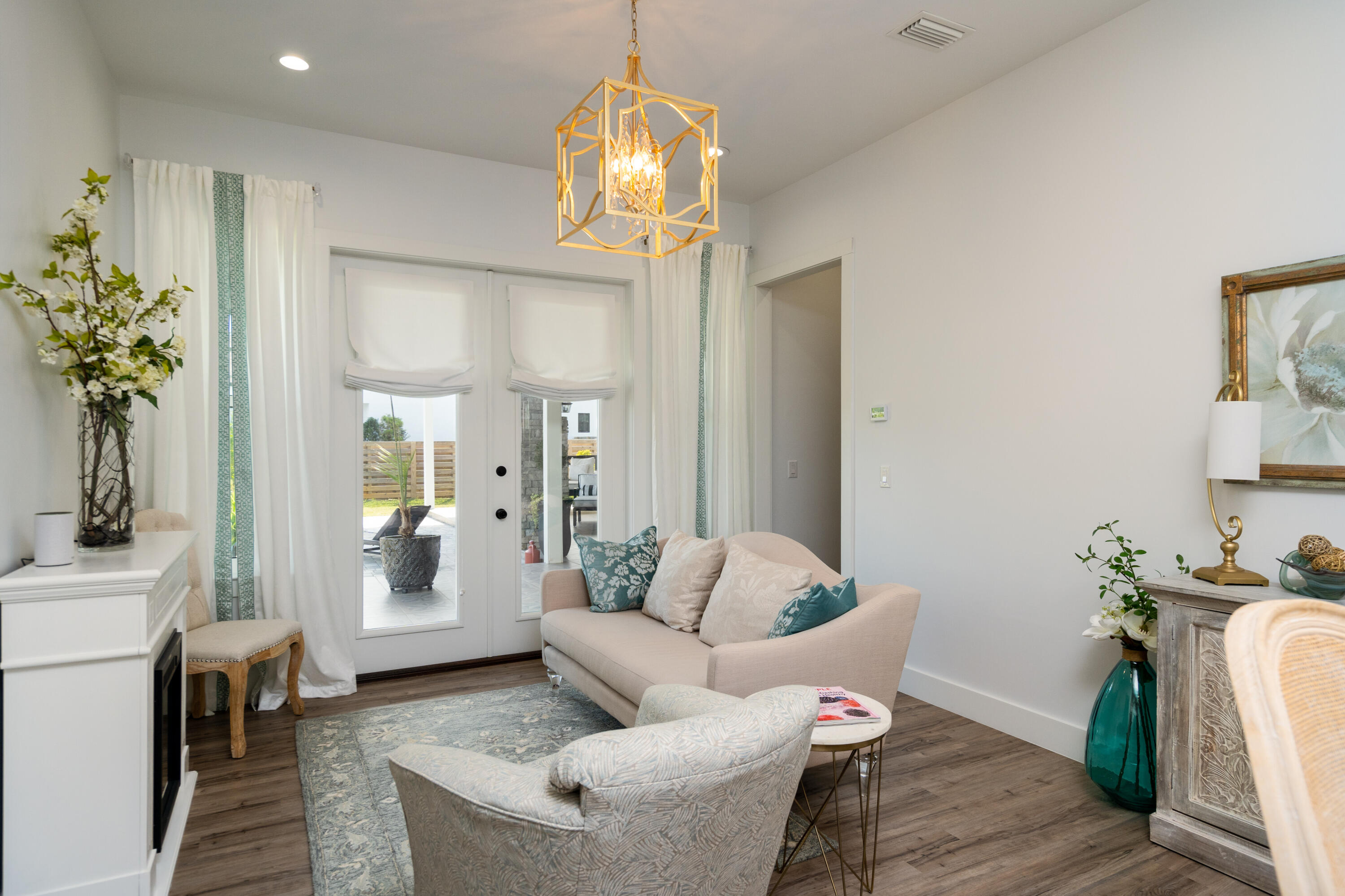334 Driftwood Point Road Santa Rosa Beach, FL 32459 - Photo 31 of 50 a living room with furniture and a chandelier