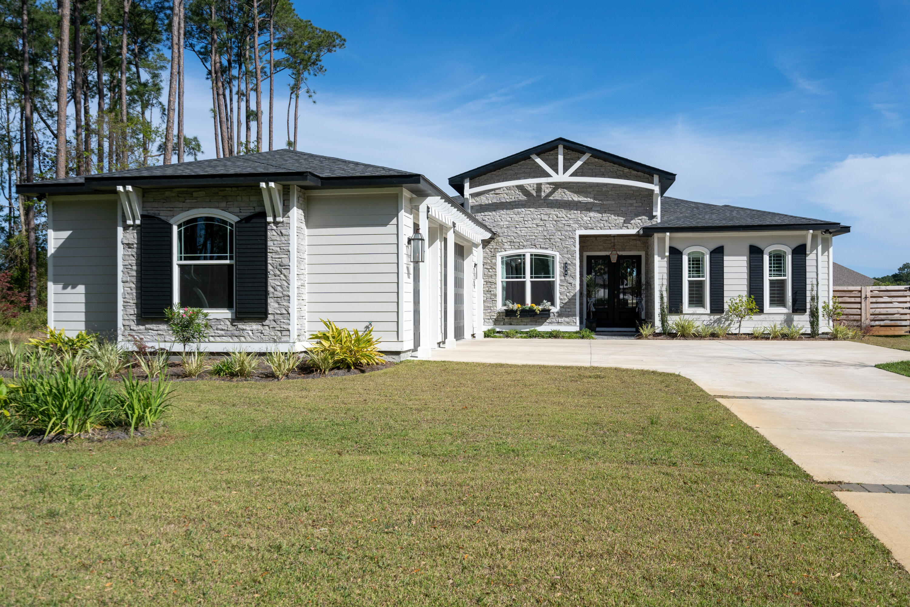 334 Driftwood Point Road Santa Rosa Beach, FL 32459 - Photo 48 of 50 a front view of a house with a garden