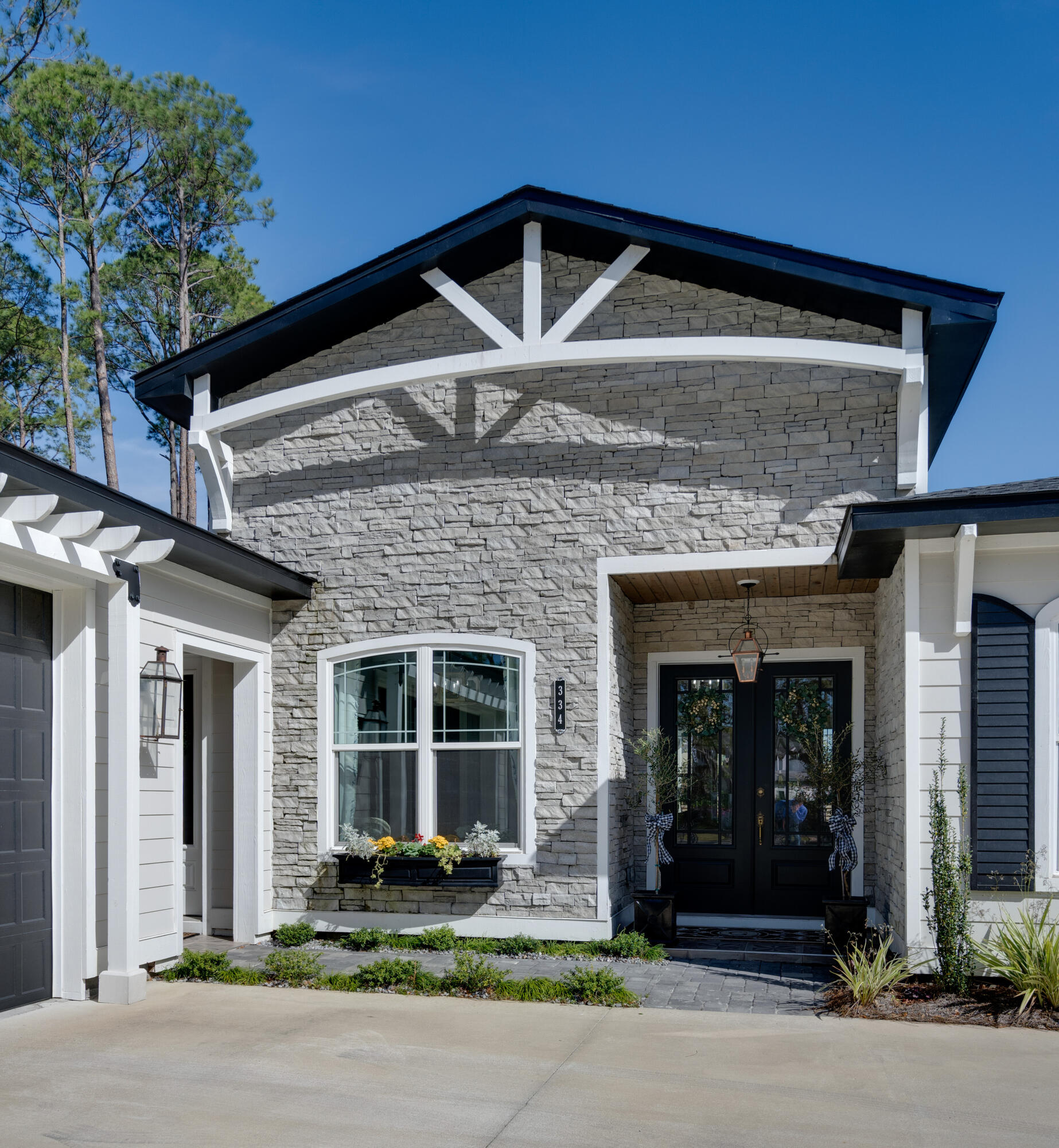 334 Driftwood Point Road Santa Rosa Beach, FL 32459 - Photo 6 of 50 a front view of a house with garden
